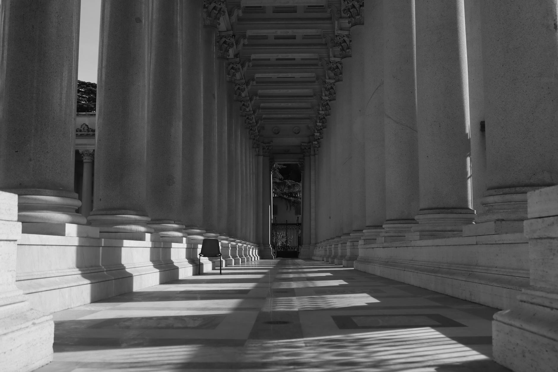 black and white photo of classical courthouse with columns