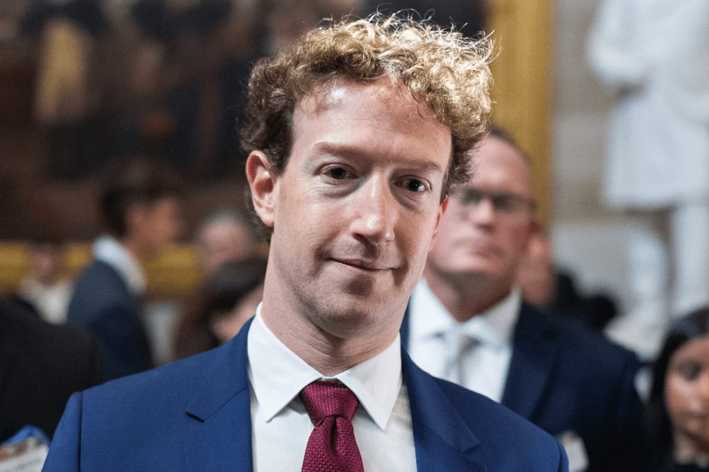Picture of man in navy suit and red tie